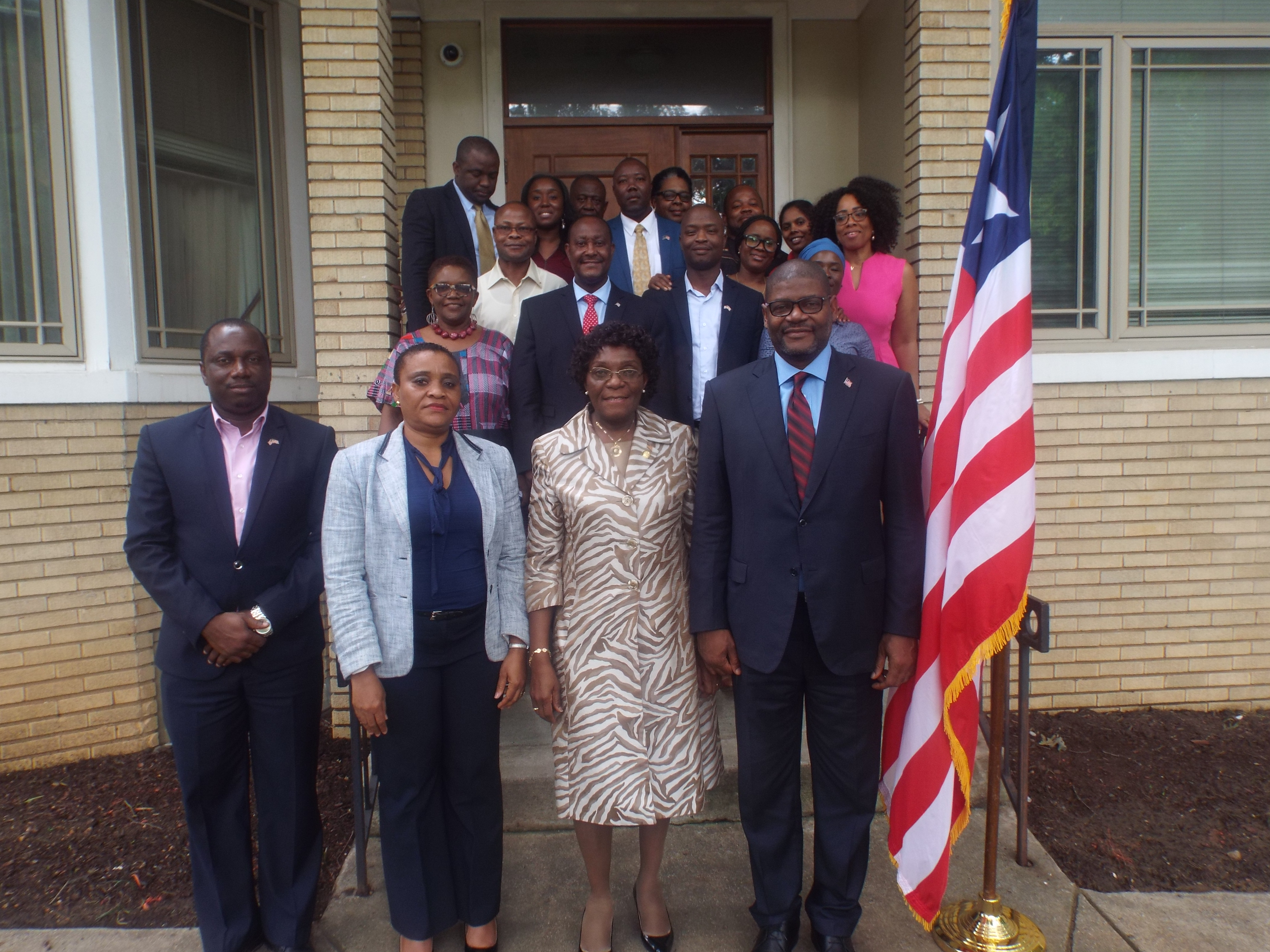 Ambassador Brutus ands Minister Findley Pose With Embassy staff at Chancery