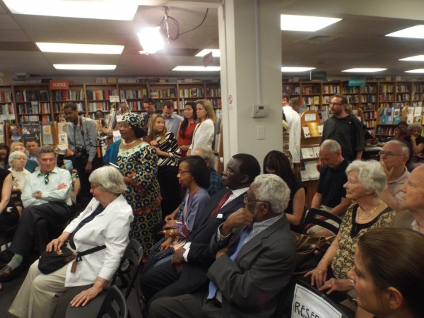 Former Malawian President Joyce Banda (in African attire) posing a question at the book signing ceremony