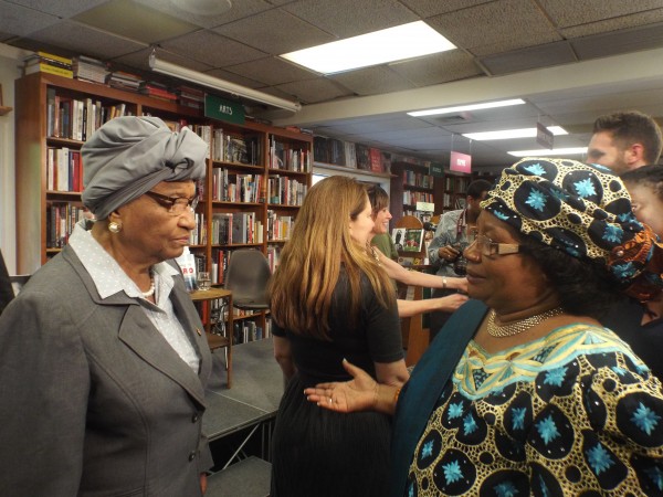  President Sirleaf confers with former Malawian President Joyce Banda at the book signing event