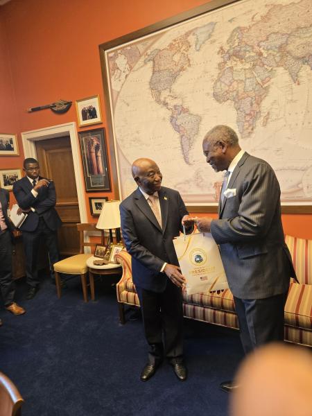 An exchange of gifts between President Boakai and Congressman Meeks